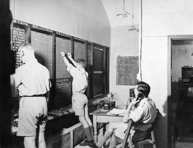 Plotting state of air squadrons on the tote board at the LWR.